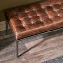 Leather bench with tan brown upholstered seat and solid iron frame