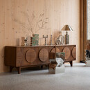 Zuiver Groove Large Walnut Sideboard displaying various decorations in a living room