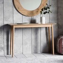 Oak wood console table with thin legs and Scandi styling