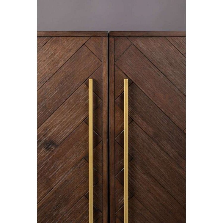 Metallic brass handle details on the Dutchbone Class Dark Wood Drinks Cabinet from Accessories for the Home Metallic brass handle details on the Dutchbone Class Dark Wood Drinks Cabinet from Accessories for the Home