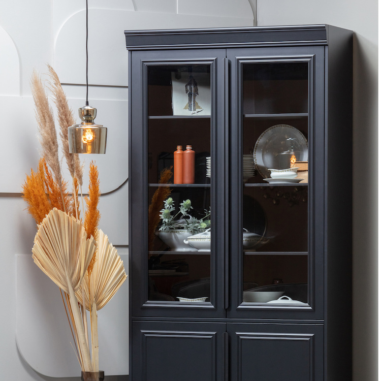 a black display cabinet with glass doors