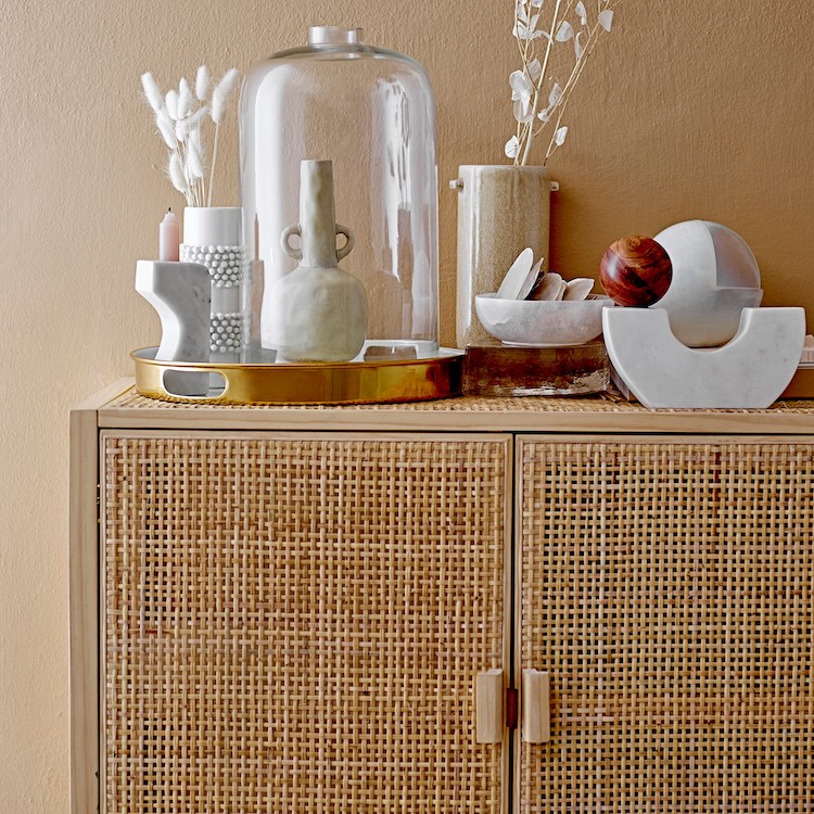 boho accessories on top of cabinet