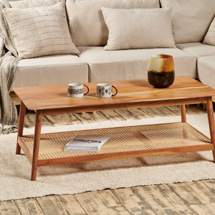 Low coffee table made from warm wood and cane