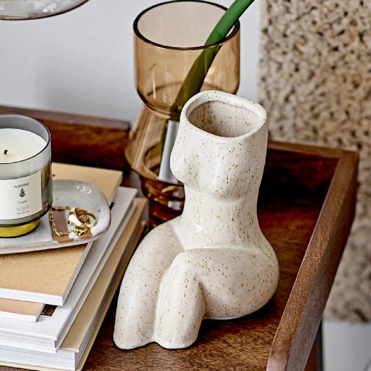 Collection of vase, books and trinkets on a tray