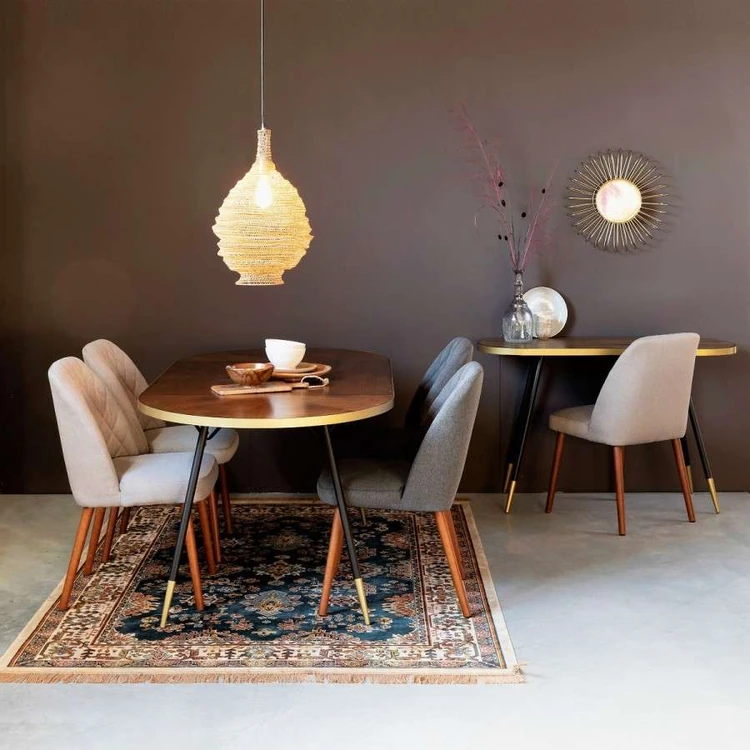 White and grey dining chairs on opposite sides of the table