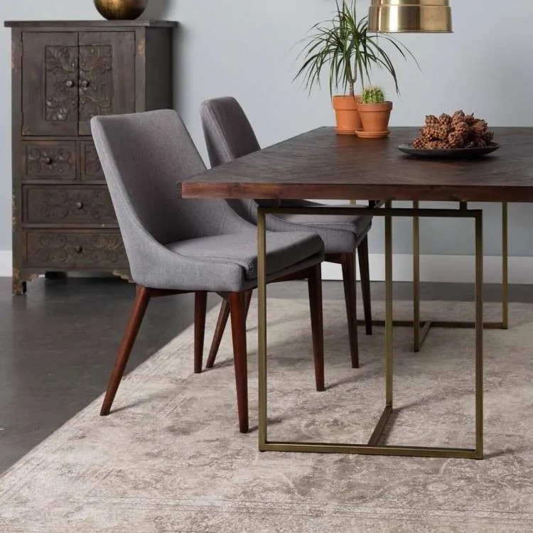 dining table and chairs on an area rug