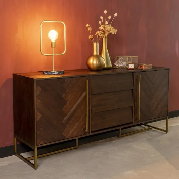 dark wood sideboard with an exposed bulb lamp