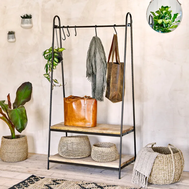 Woven baskets displayed on a coat stand shelving unit