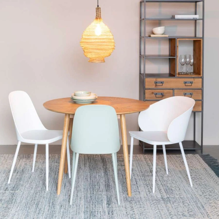 White and blue chairs around a dining table in a Scandi style room