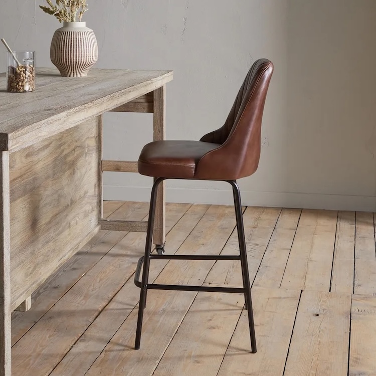leather bar stool and rustic table