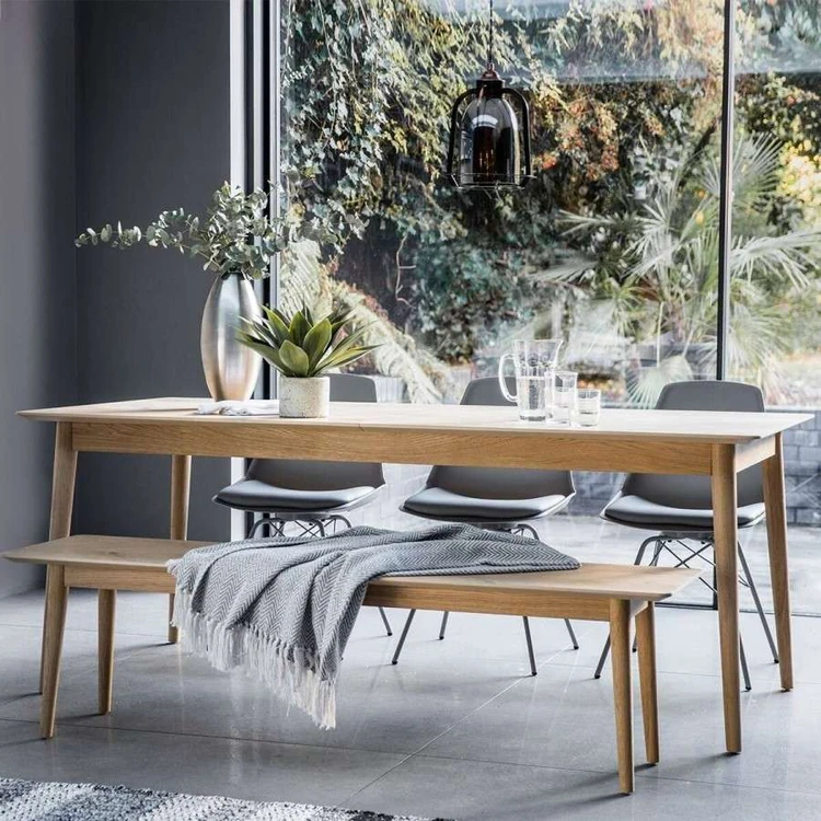 Dining bench and grey chairs around a Scandi dining table