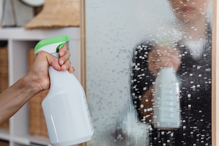 spraying a mirror