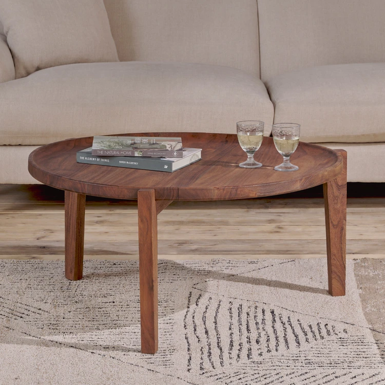 Dark wood coffee table in beige living room