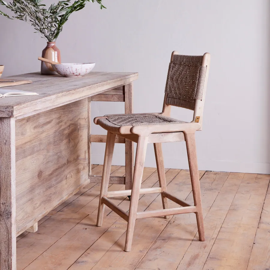 Scandi style bar chair at kitchen counter with light wood tones
